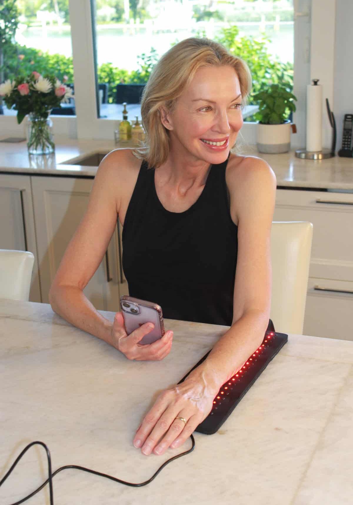 Red Light Therapy for arm pain in the kitchen